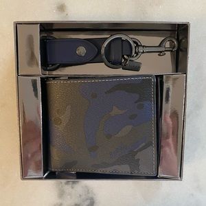 Coach men’s wallet and matching keychain set.